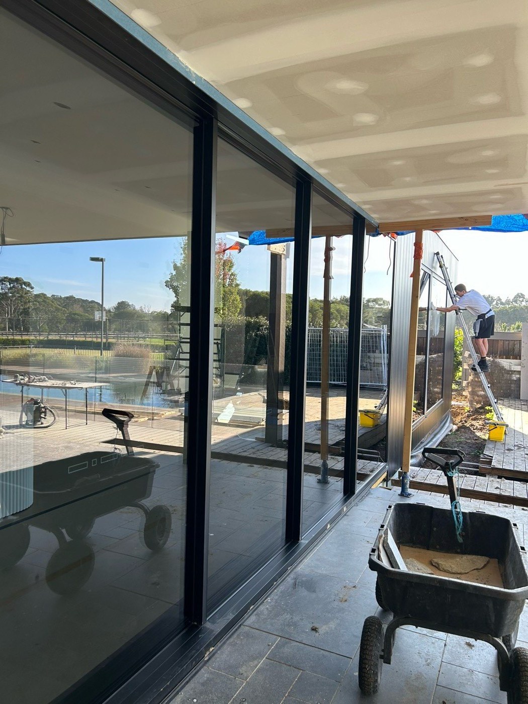 Before and after window cleaning on a new build — Mornington Peninsula