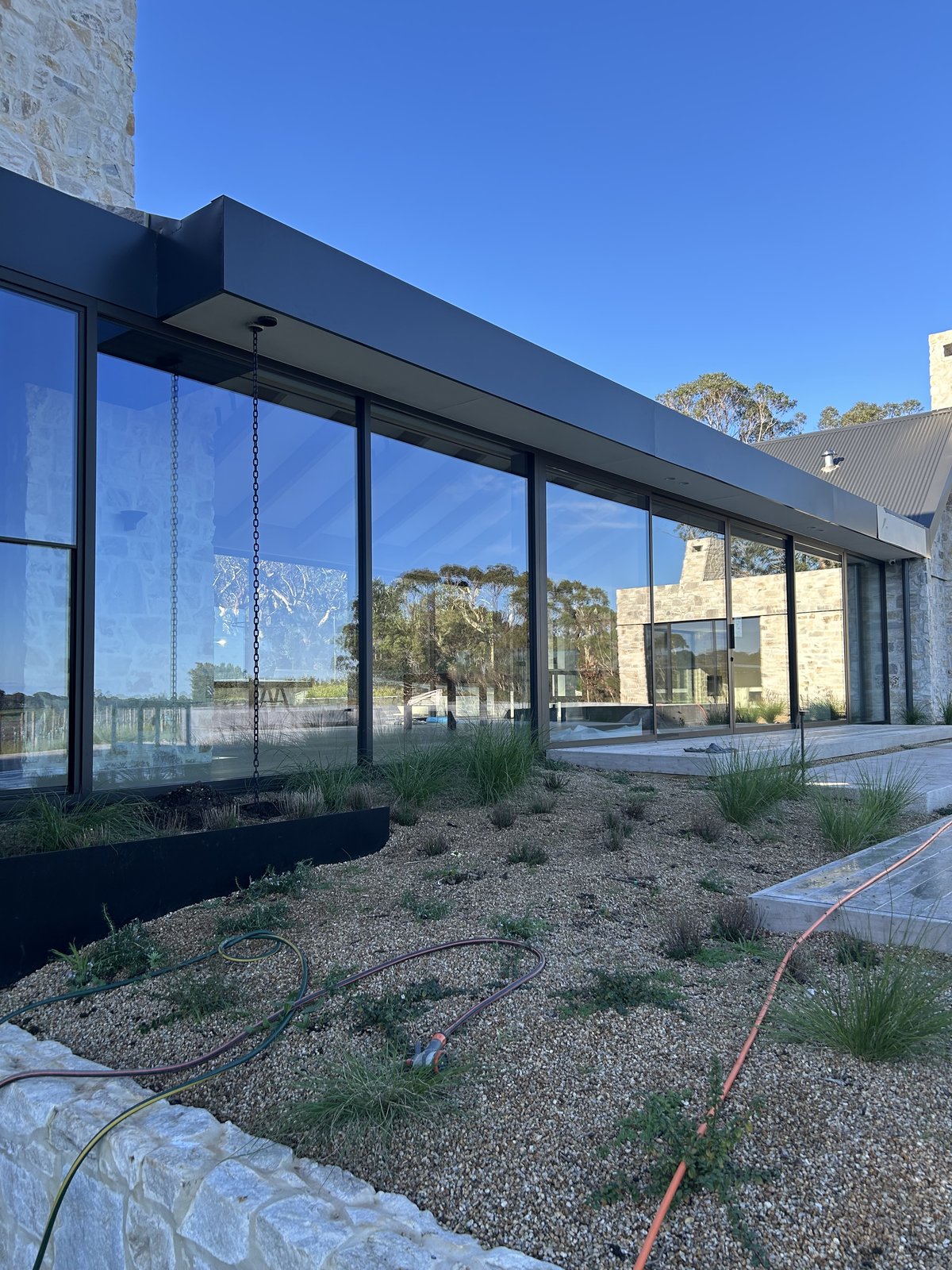 Bay to Bay builders clean — floor-to-ceiling glass panels
